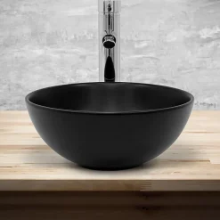 Lavabo à poser rond noir mat céramique avec garniture de vidage