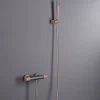 Mitigeur douche thermostatique champagne en laiton et zama avec flexible PVC