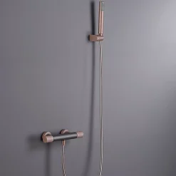 Mitigeur douche thermostatique champagne en laiton et zama avec flexible PVC